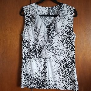 Ruffled v-neck sleeveless blouse.